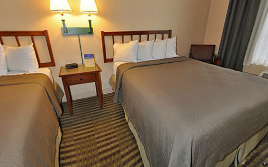 Norwood Inn And Suites Chaska Quarto foto